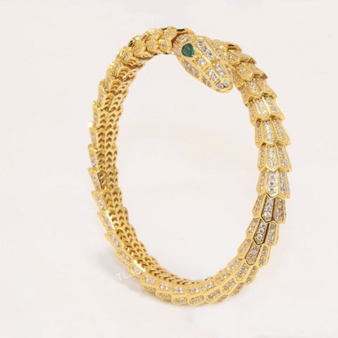 Premium Gold Bracelet  Diamonds and Two Emerald Eyes.