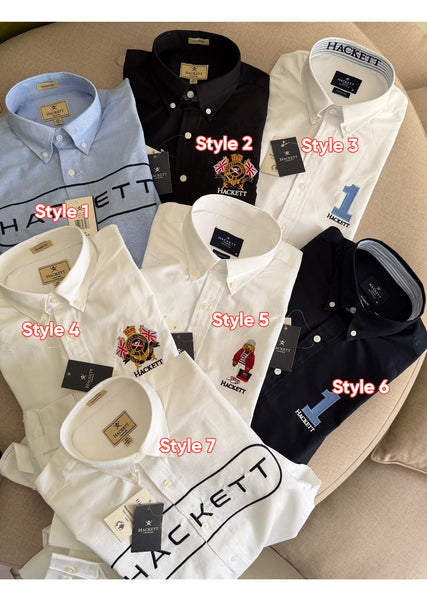 Premium men's shirts collection featuring classic fit button-down shirts in white, black, navy and light blue with embroidered crest, bear and number 1 logo designs