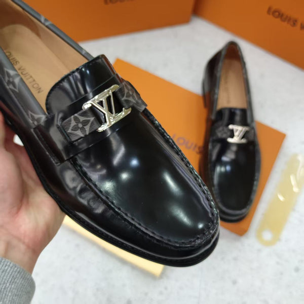 Black Shoes with Patterned Strap and Silver Buckle