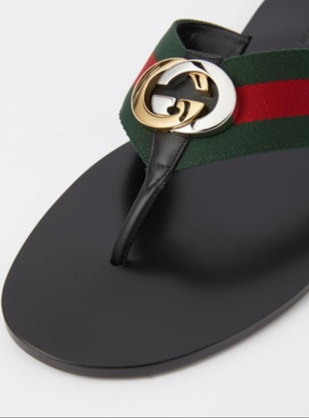 Stylish Black Flat Sandals with Signature Stripe Strap & Gold Logo Detail