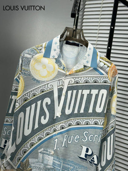 Premium brand men's long sleeve shirts in orange and blue colorways featuring 1 Rue Scribe Paris heritage graphic print with LV monogram pattern on display stands