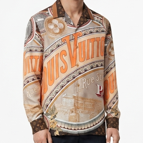 Premium brand men's long sleeve shirts in orange and blue colorways featuring 1 Rue Scribe Paris heritage graphic print with LV monogram pattern on display stands